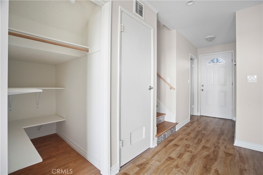 11311 Tampa Avenue, Unit 21 Porter Ranch, CA 91326 - Photo 7 of 36 a view of hallway with wooden floor