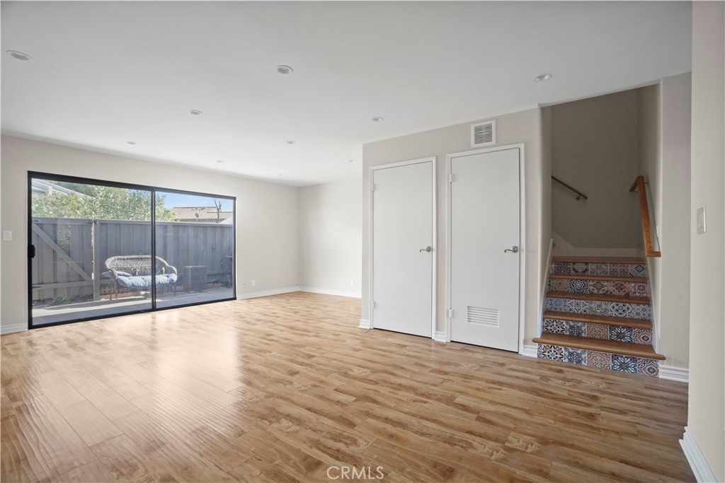 11311 Tampa Avenue, Unit 21 Porter Ranch, CA 91326 - Photo 8 of 36 a view of empty room with wooden floor and fan