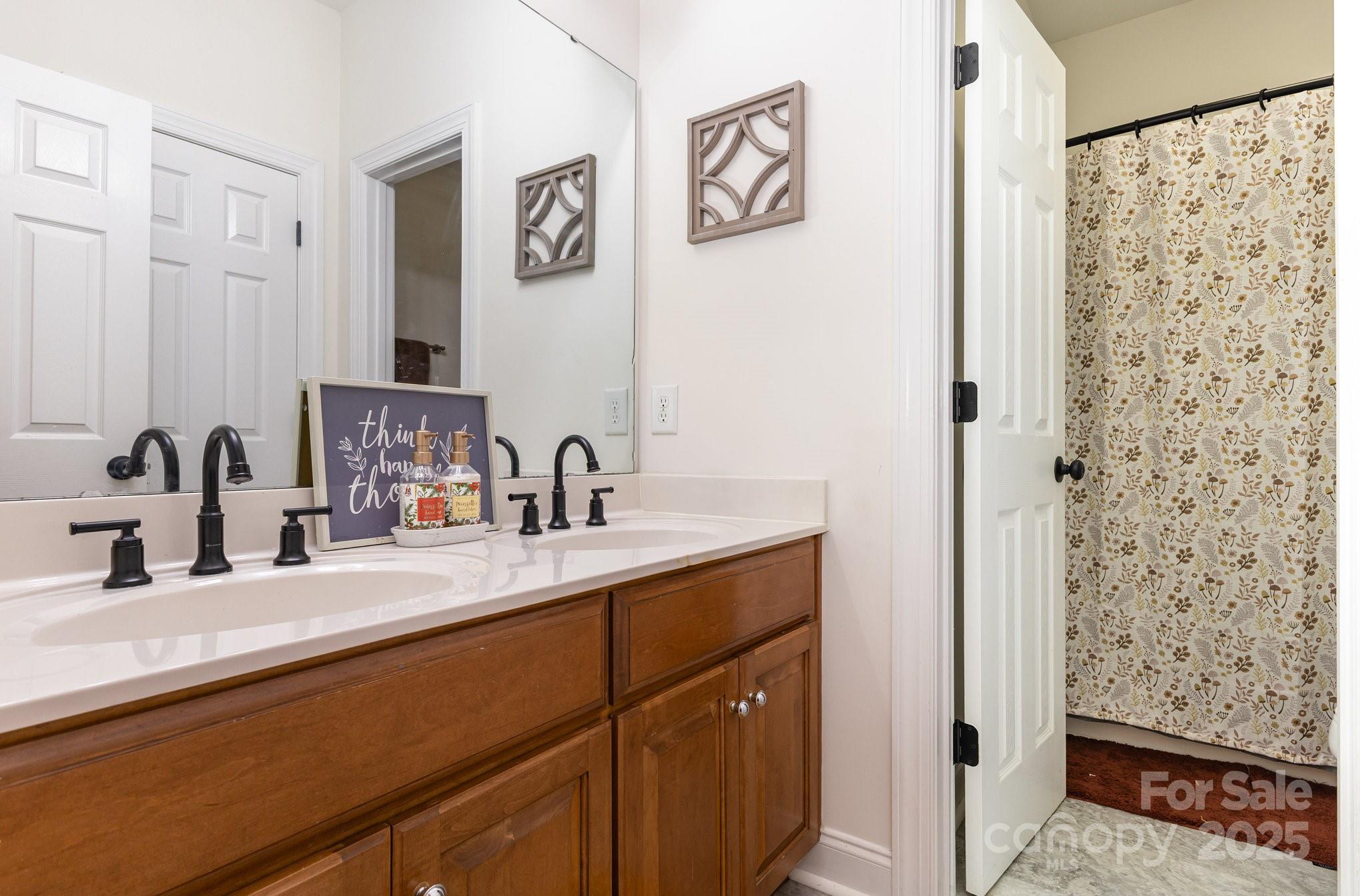 324 Old Hardin Road Dallas, NC 28034 - Photo 24 of 35 a bathroom with a sink and a mirror
