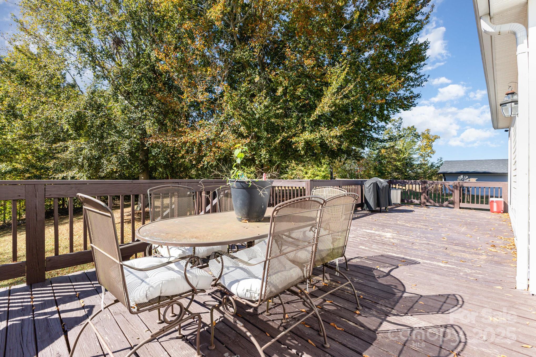 324 Old Hardin Road Dallas, NC 28034 - Photo 30 of 35 a roof deck with chairs and potted plants