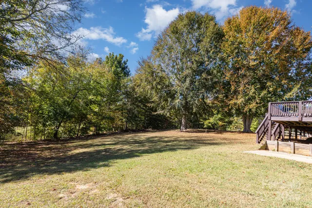 a view of swimming pool with a yard
