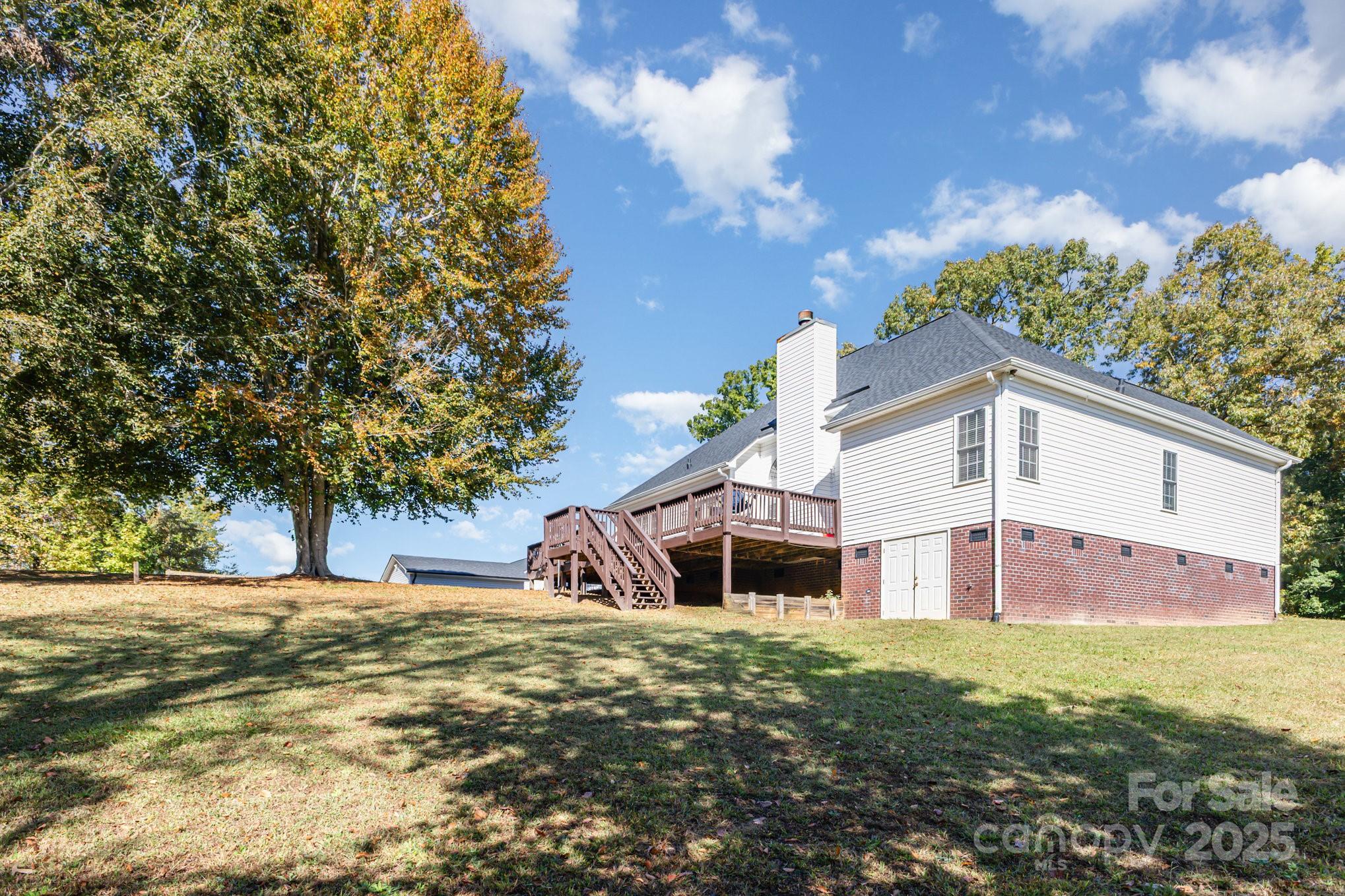 324 Old Hardin Road Dallas, NC 28034 - Photo 34 of 35 a front view of a house with garden
