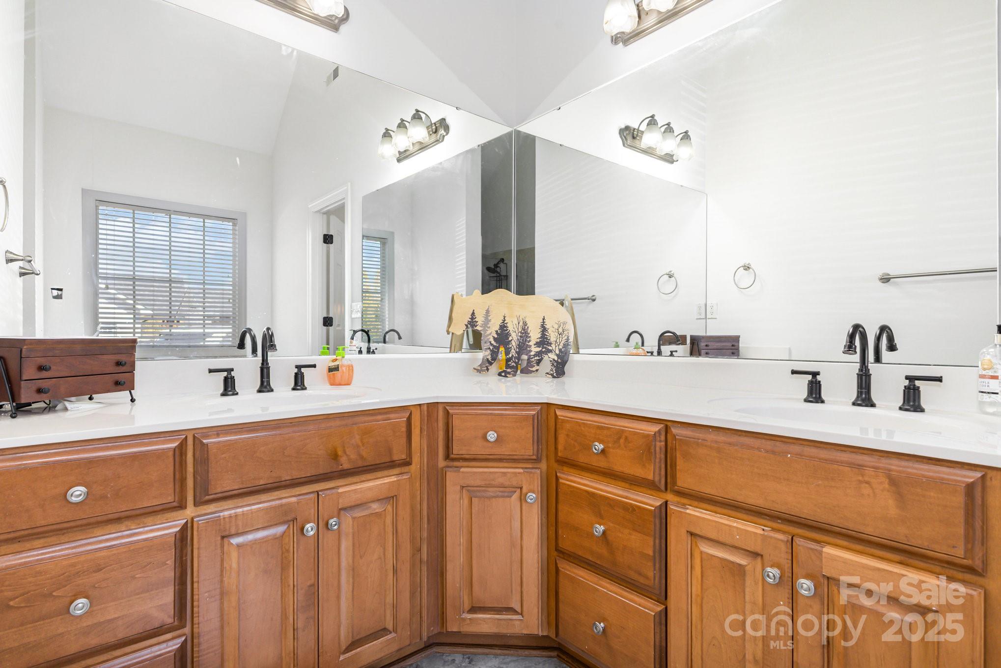 324 Old Hardin Road Dallas, NC 28034 - Photo 4 of 35 a bathroom with a sink and a mirror