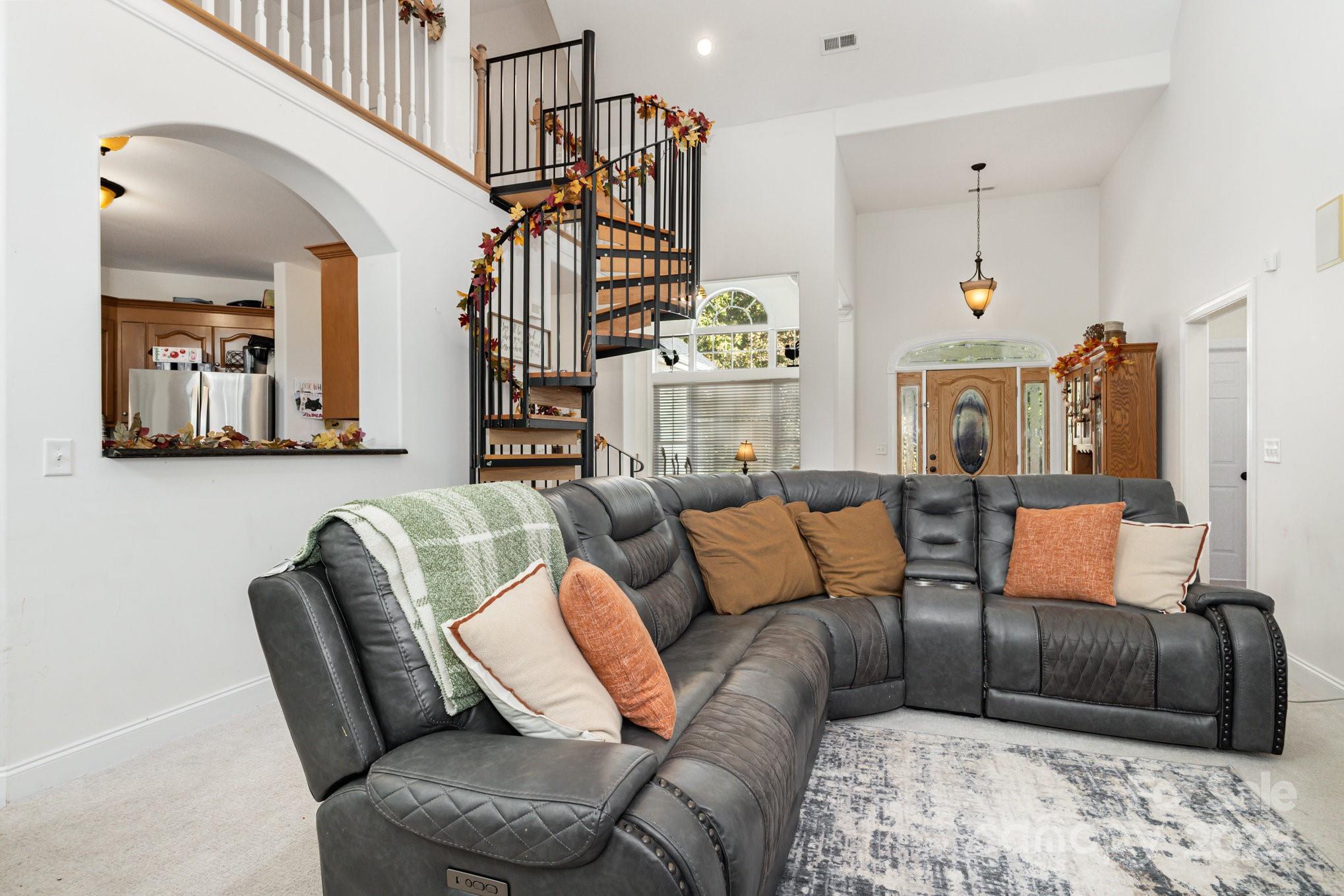 324 Old Hardin Road Dallas, NC 28034 - Photo 9 of 35 a living room with furniture or couch and a chandelier