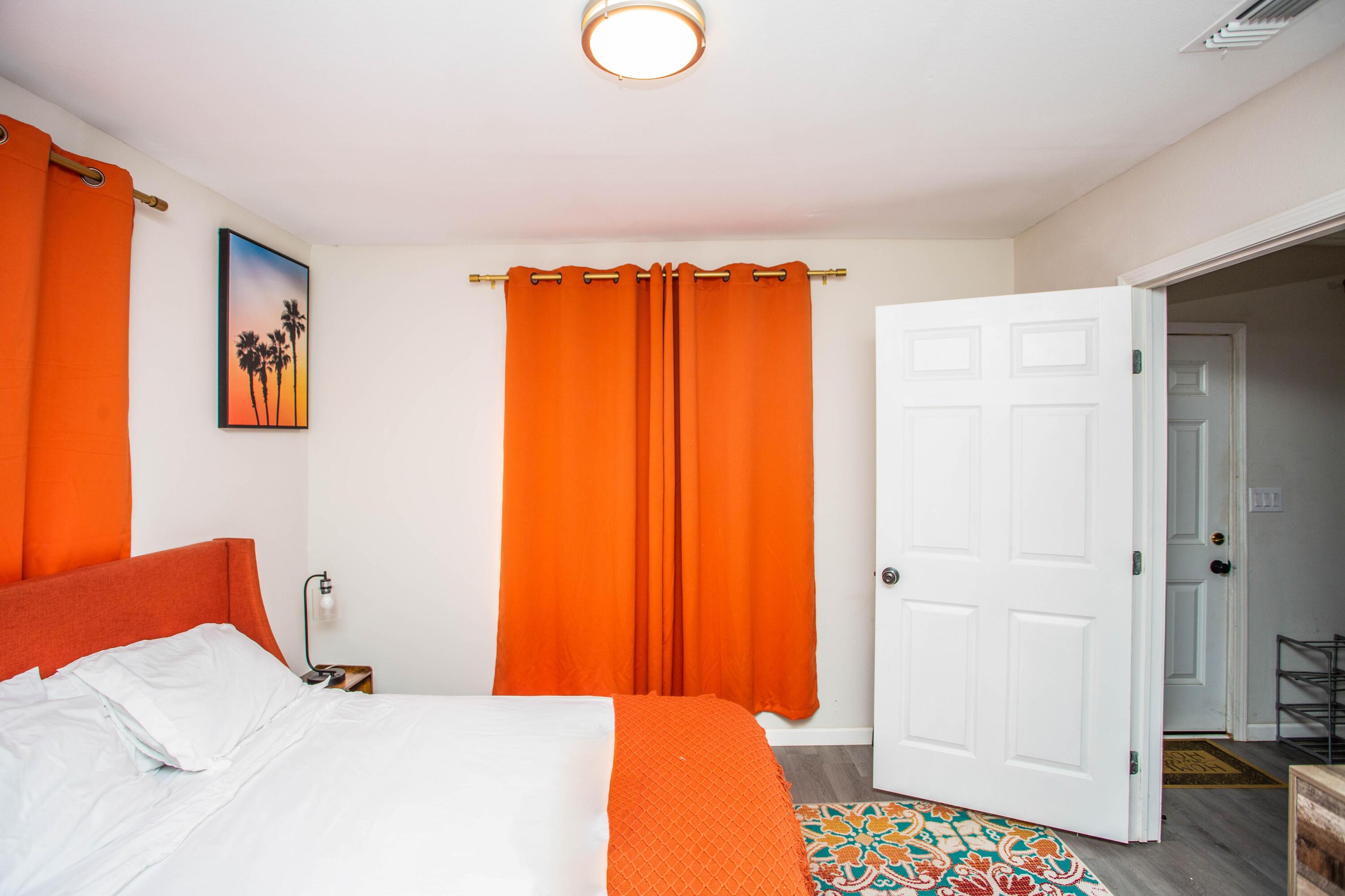 2808 Amherst Street Lubbock, TX 79415 - Photo 13 of 26 a bedroom with a bed and a painting on the wall