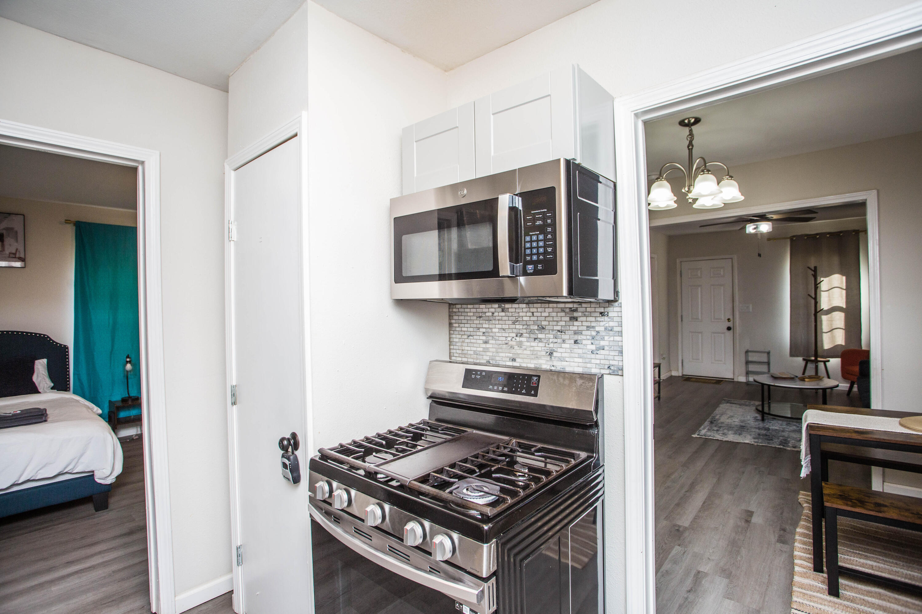 2808 Amherst Street Lubbock, TX 79415 - Photo 10 of 26 a kitchen with a stove and a microwave
