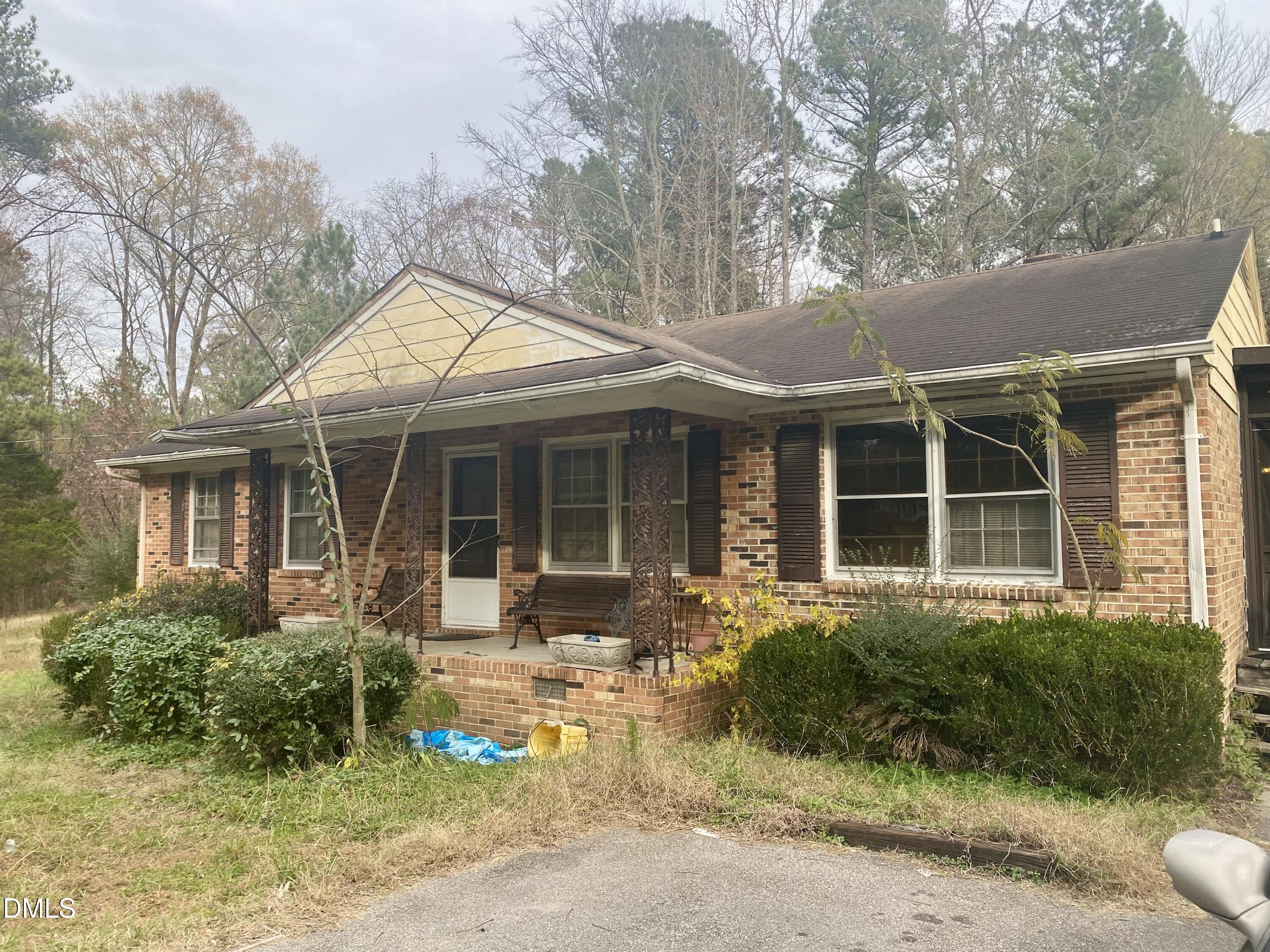 142 Kings Road Henderson, NC 27537 - Photo 2 of 9 front view of a house with a yard