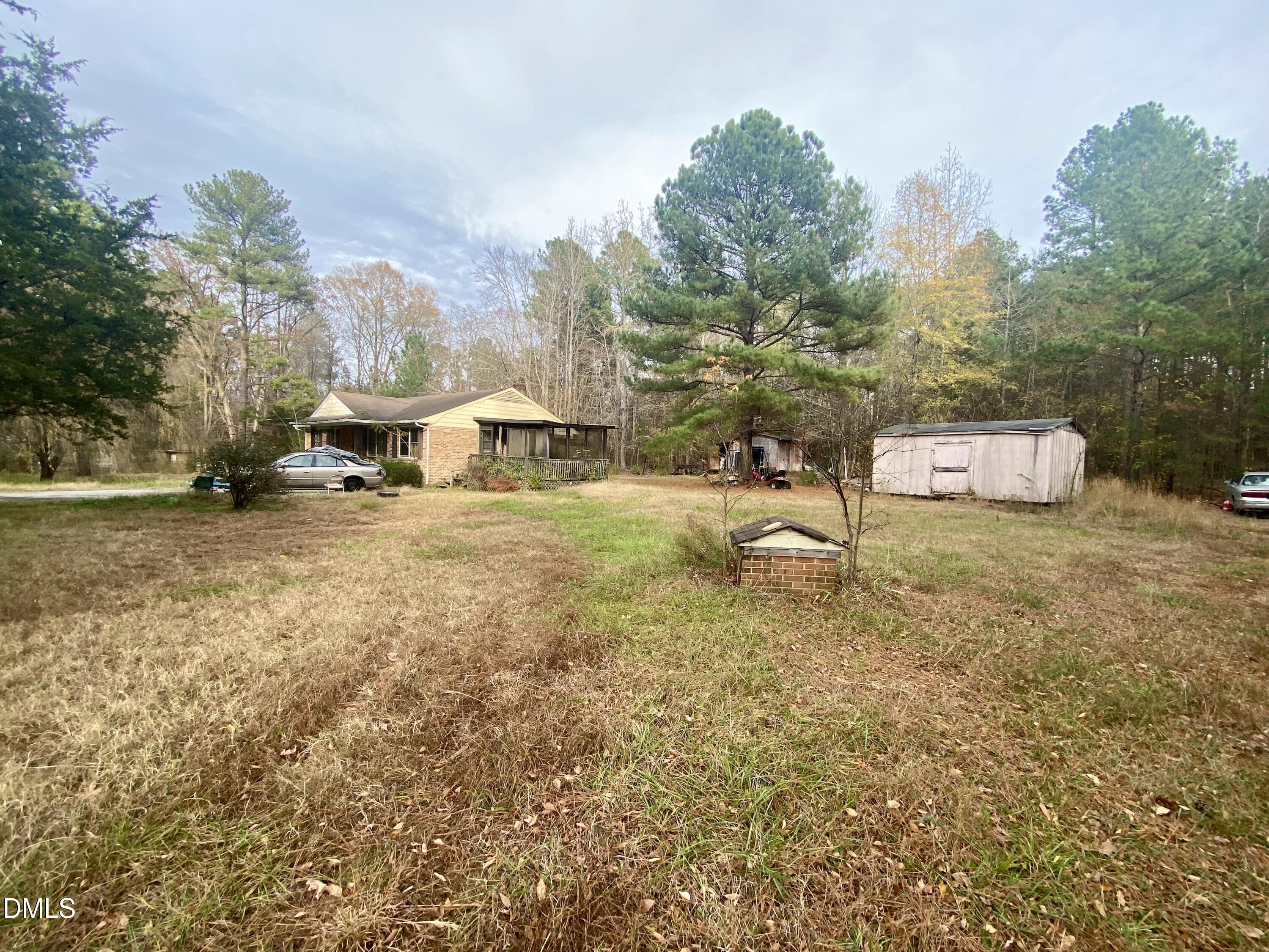 142 Kings Road Henderson, NC 27537 - Photo 7 of 9 a view of a town with trees and houses