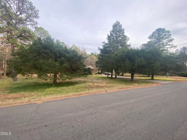 a view of swimming pool with trees in the background