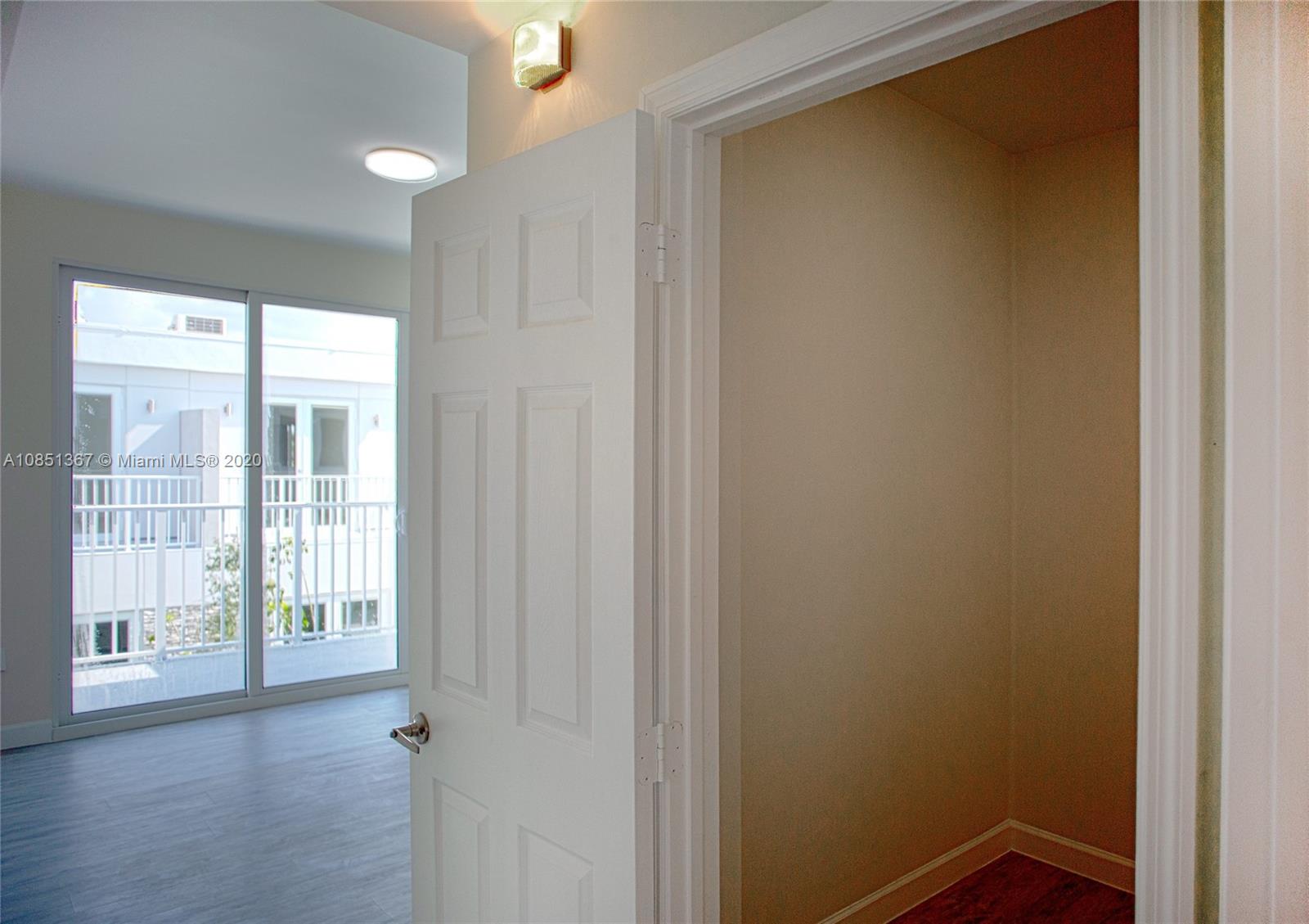 13724 Southwest 259th Street Homestead, FL 33032 - Photo 12 of 20 a view of an empty room with wooden floor and a window