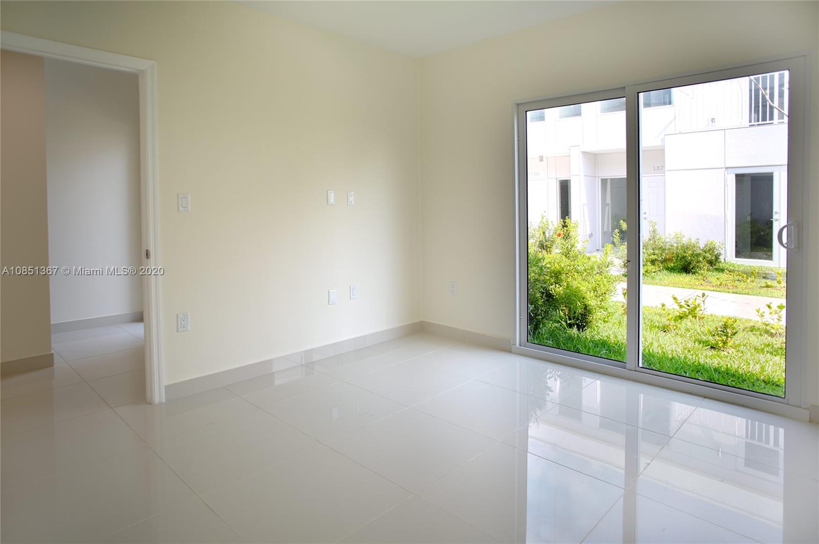 13724 Southwest 259th Street Homestead, FL 33032 - Photo 13 of 20 a view of a room with a large window