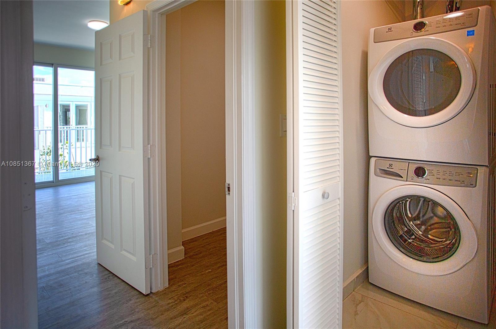 13724 Southwest 259th Street Homestead, FL 33032 - Photo 15 of 20 a view of a hallway with washer and dryer