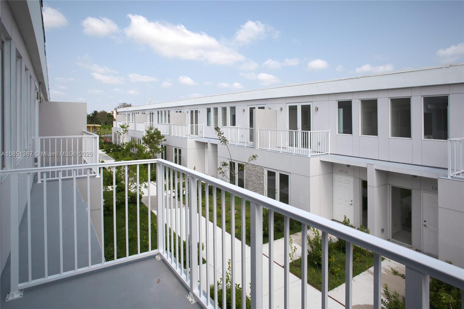 13724 Southwest 259th Street Homestead, FL 33032 - Photo 4 of 20 a view of a balcony with front door