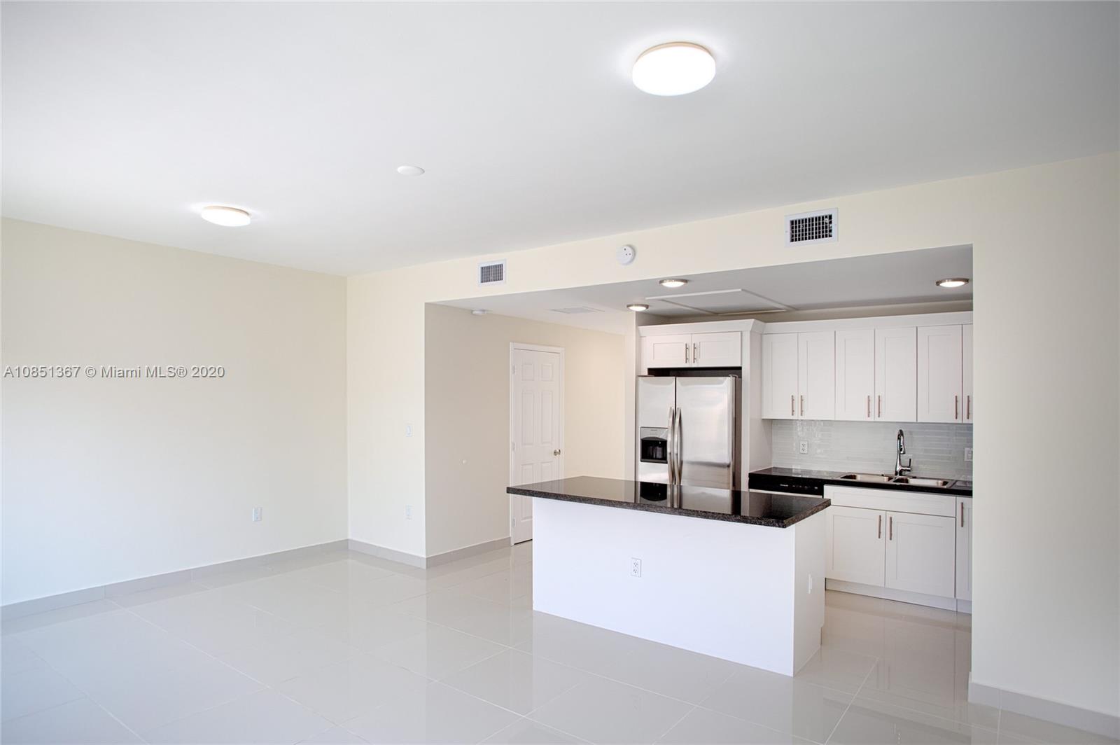 13724 Southwest 259th Street Homestead, FL 33032 - Photo 8 of 20 a kitchen with counter top space and cabinets