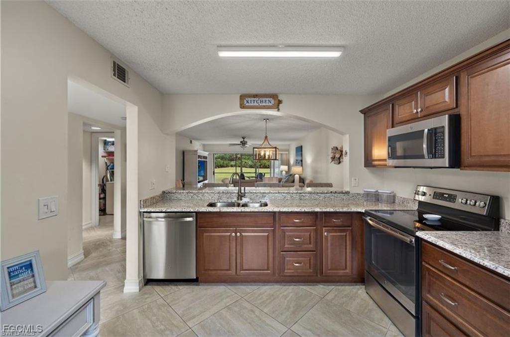 7025 Dennis Circle, Unit G104 Naples, FL 34104 - Photo 2 of 25