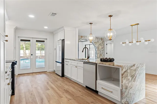 a view of white cabinets and window