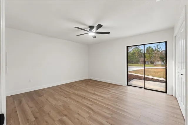 a bathroom with a granite countertop sink and a shower