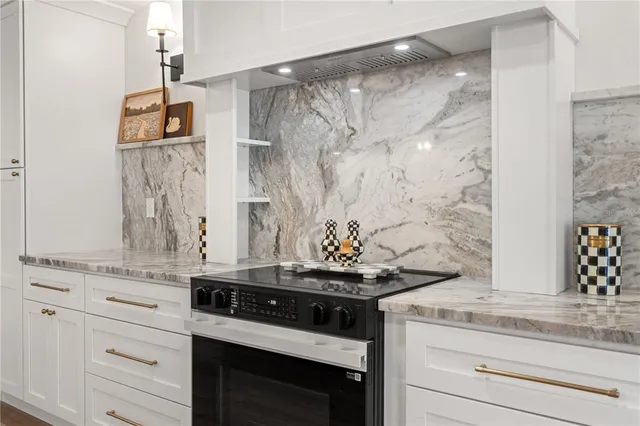 a view of a kitchen with refrigerator stove microwave and stove