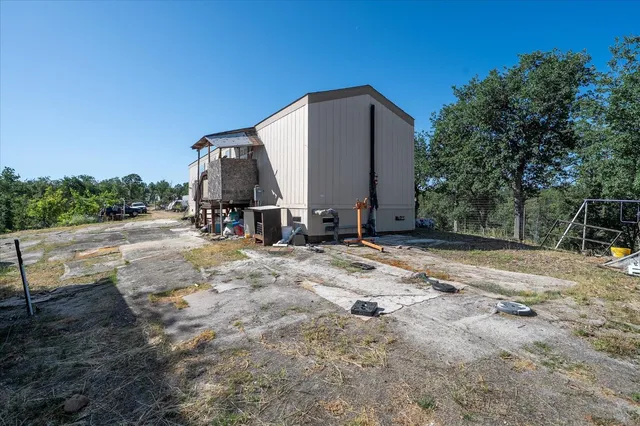 a view of backyard with a slide