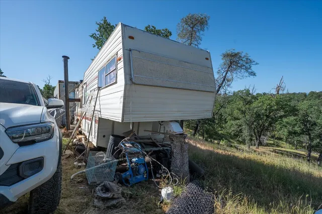 an aerial view of a house with yard swimming pool and outdoor seating