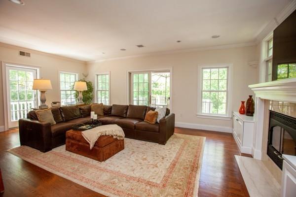 38 Kenilworth Road Wellesley, MA 02482 - Photo 13 of 36 a living room with fireplace furniture and a wooden floor
