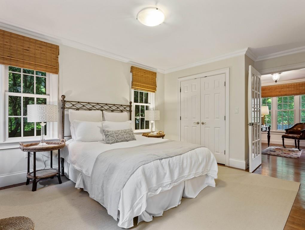 38 Kenilworth Road Wellesley, MA 02482 - Photo 15 of 36 a bedroom with a bed a table and windows