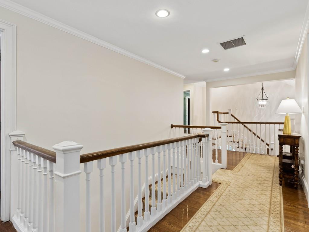 38 Kenilworth Road Wellesley, MA 02482 - Photo 17 of 36 a view of a hallway with wooden floor and stairs