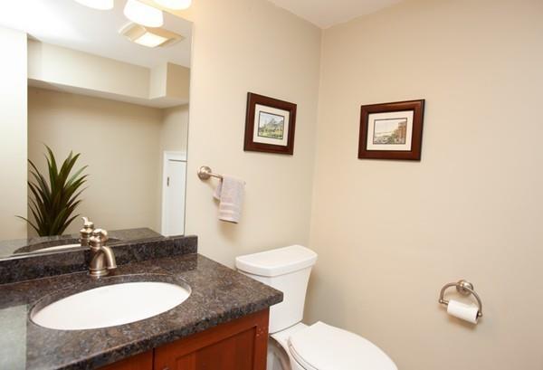 38 Kenilworth Road Wellesley, MA 02482 - Photo 28 of 36 a bathroom with a granite countertop toilet sink and mirror