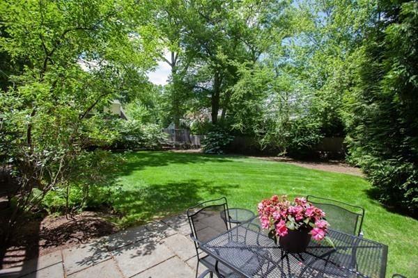 38 Kenilworth Road Wellesley, MA 02482 - Photo 34 of 36 a view of a table and chairs in a garden