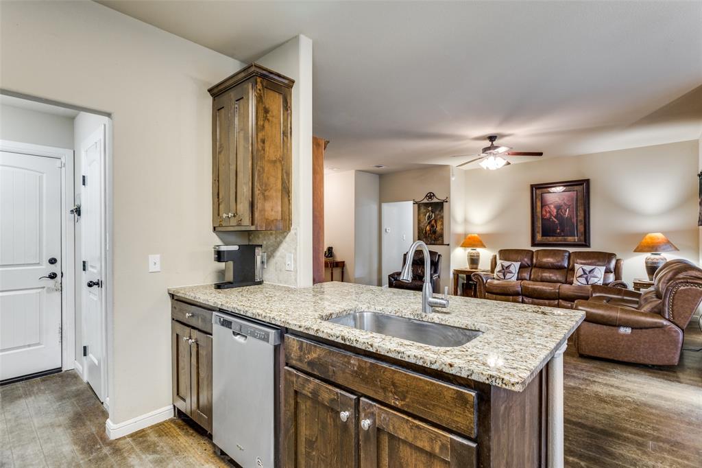 129 Ronnie Lane Weatherford, TX 76088 - Photo 17 of 36 a bathroom with sinks granite countertop a sink and a mirror