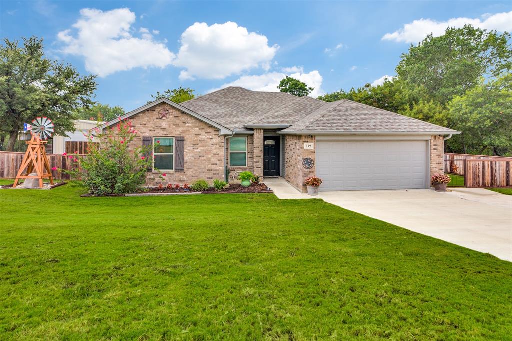 129 Ronnie Lane Weatherford, TX 76088 - Photo 2 of 36 a front view of house with yard and green space