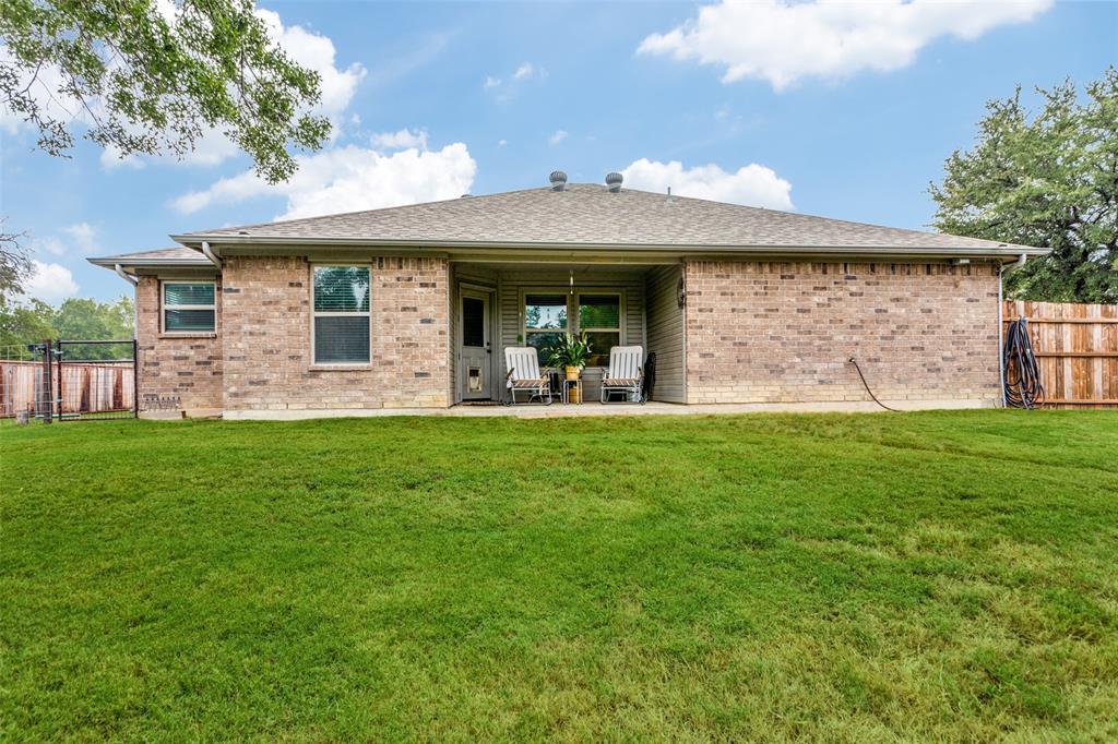 129 Ronnie Lane Weatherford, TX 76088 - Photo 26 of 36 a front view of a house with garden
