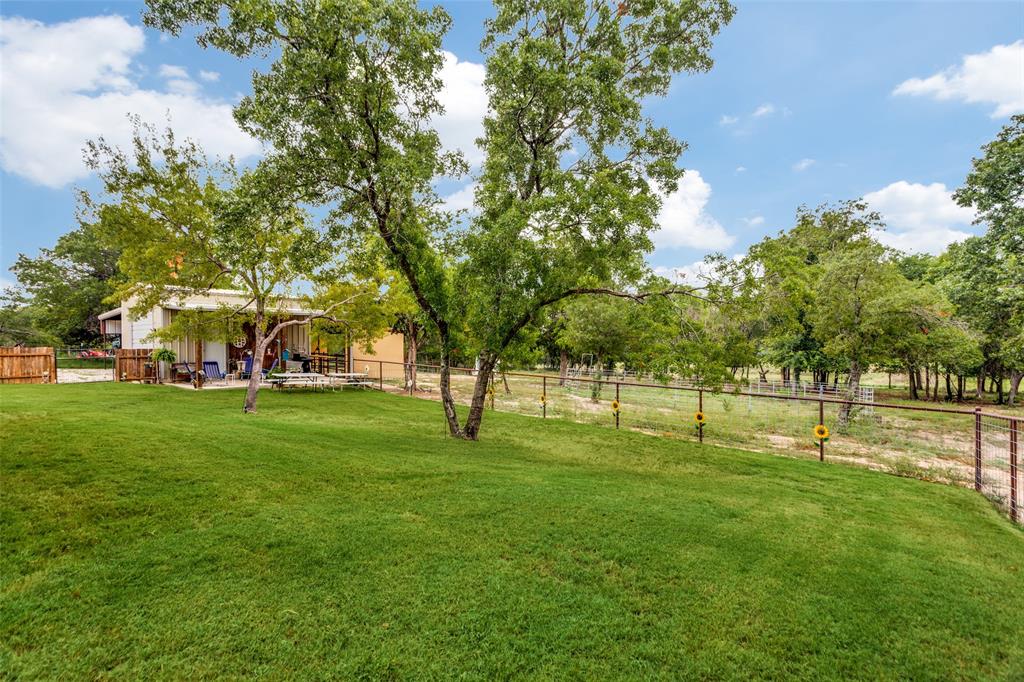 129 Ronnie Lane Weatherford, TX 76088 - Photo 27 of 36 a view of yard with green space and trees