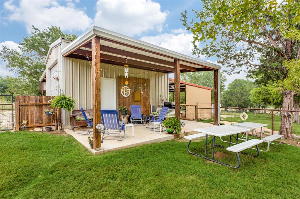 129 Ronnie Lane Weatherford, TX 76088 - Photo 28 of 36 a garden view with a seating space and garden