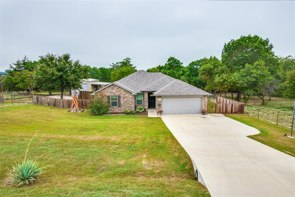 129 Ronnie Lane Weatherford, TX 76088 - Photo 31 of 36 a view of pool with table and chairs under an umbrella