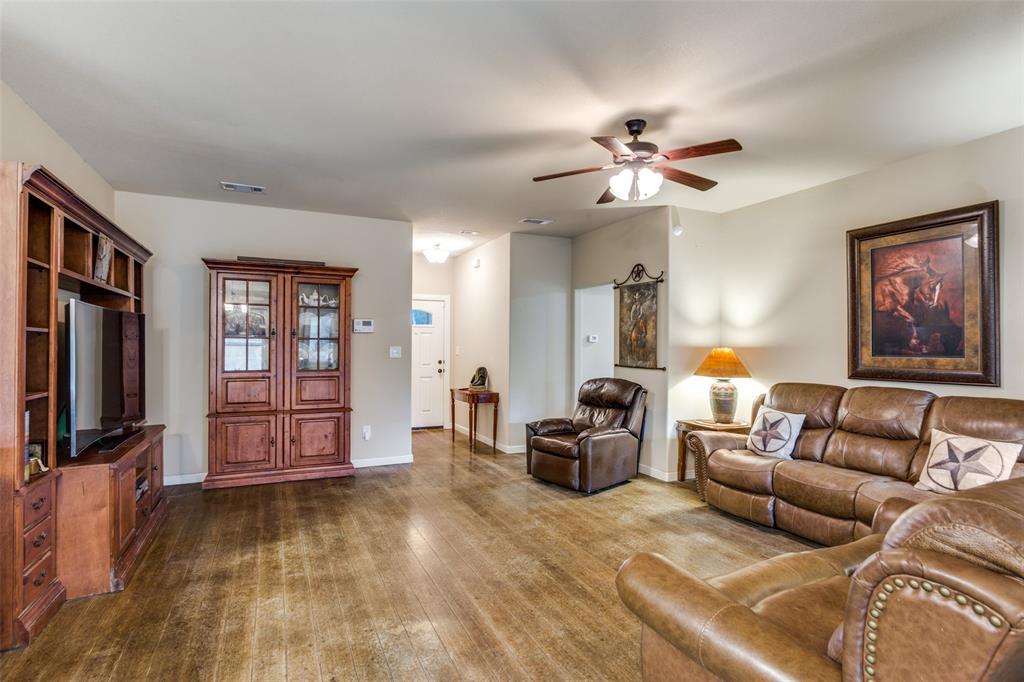 129 Ronnie Lane Weatherford, TX 76088 - Photo 9 of 36 a living room with furniture and a flat screen tv