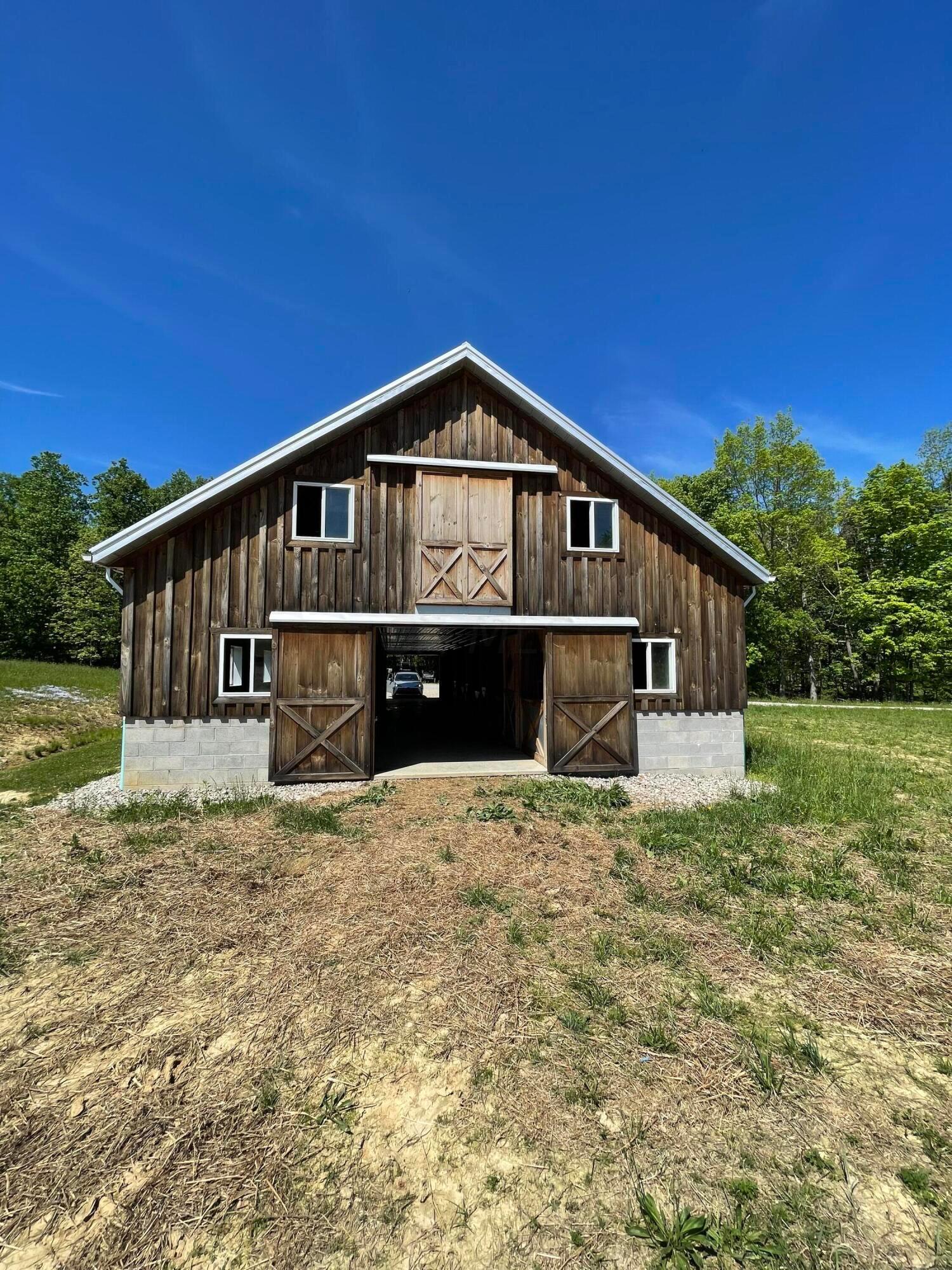 150 James Bowen Road Jackson, OH 45640 - Photo 39 of 43 Batten board siding on gorgeous horse barn