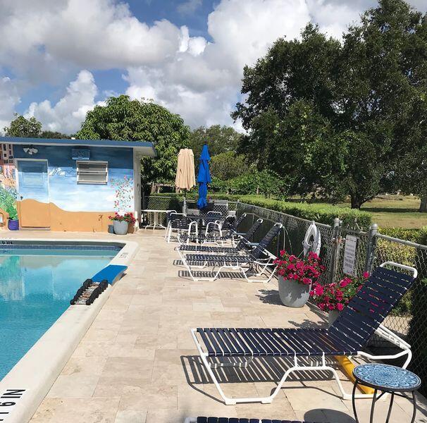 5401 Northwest 2nd Avenue, Unit 319 Boca Raton, FL 33487 - Photo 16 of 20 Pool Flowers