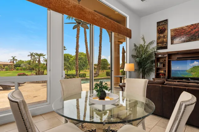 a view of a dining room with furniture window and outside view