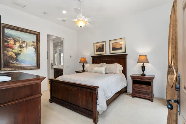 a bed room with a bed and a painting on the wall