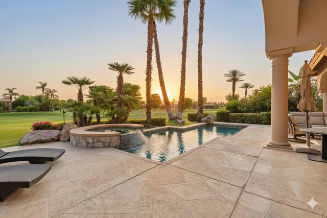 a view of swimming pool with seating space and yard