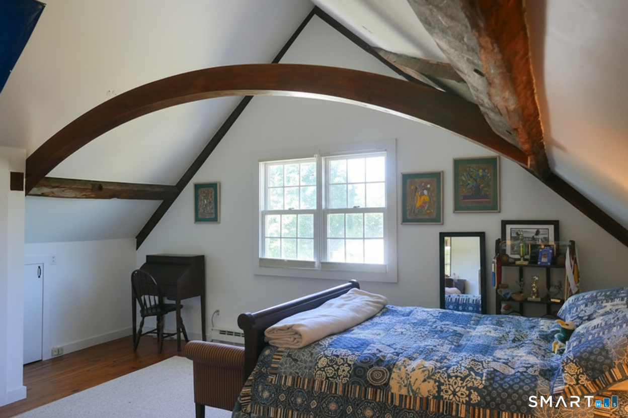 147 Boston Street Guilford, CT 06437 - Photo 23 of 38 a bedroom with a bed and a window