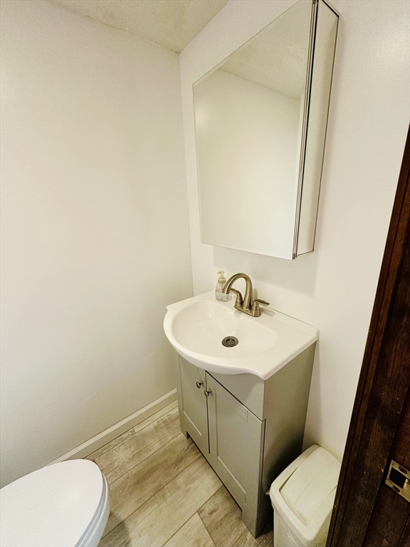 128 Sherwood Road Springfield, MA 01119 - Photo 15 of 39 a bathroom with a sink a toilet and a mirror