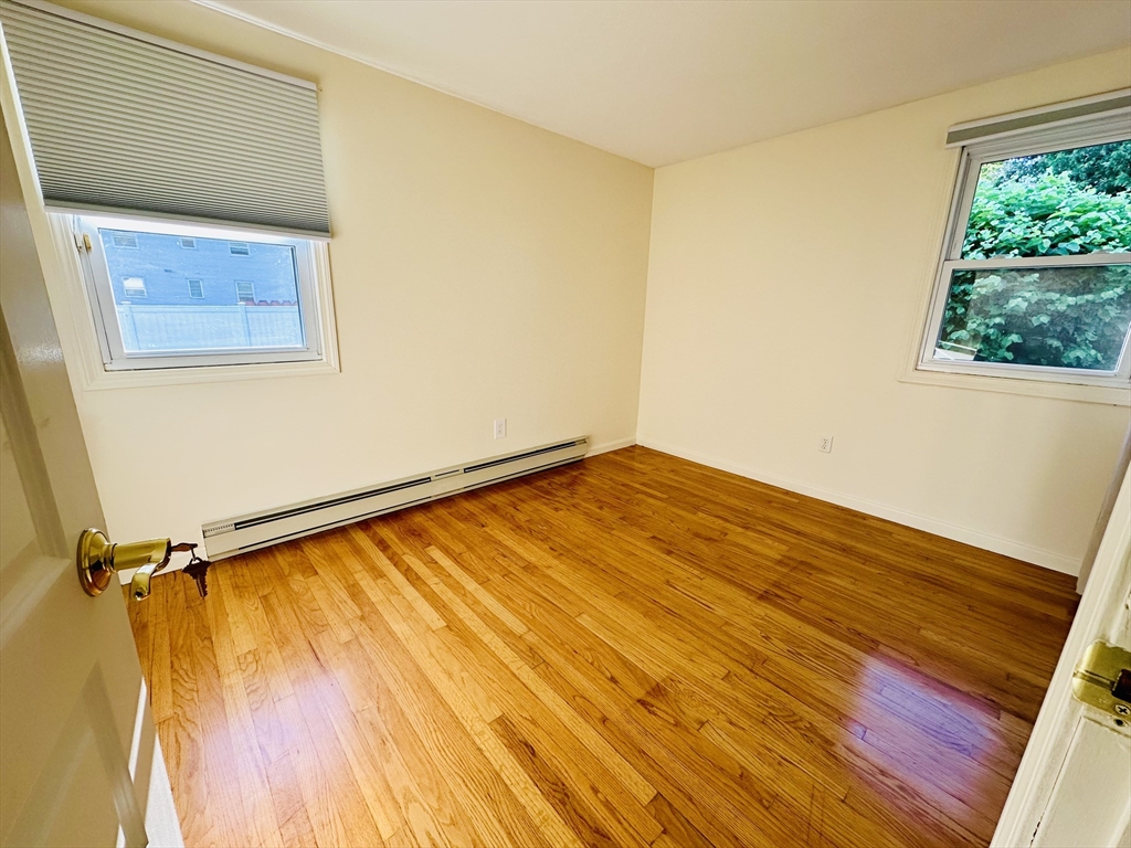 128 Sherwood Road Springfield, MA 01119 - Photo 17 of 39 a view of a room with wooden floor and a window