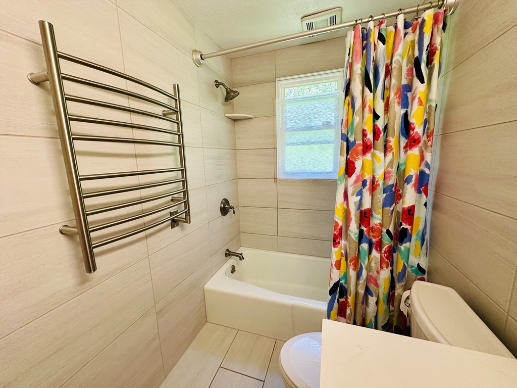 128 Sherwood Road Springfield, MA 01119 - Photo 21 of 39 a bathroom with a toilet and a bathtub