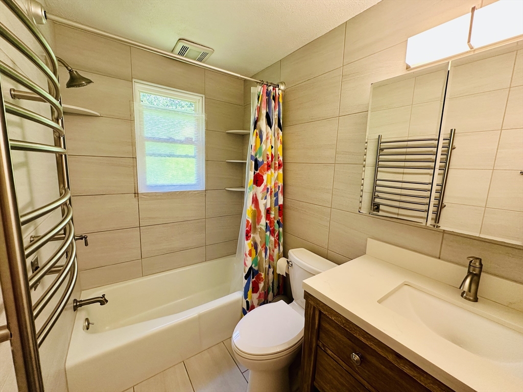 128 Sherwood Road Springfield, MA 01119 - Photo 35 of 39 a bathroom with a sink a toilet and shower