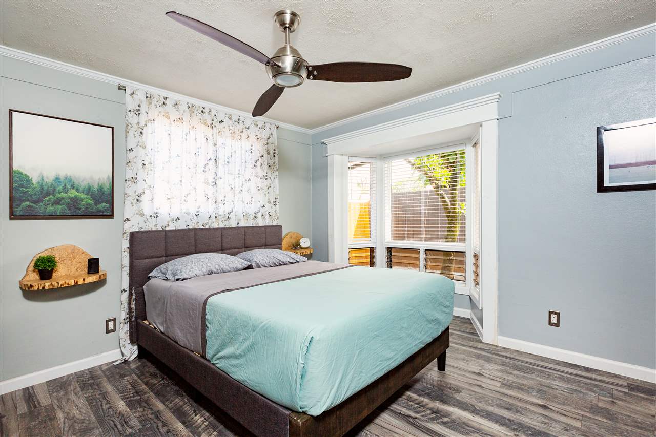 805 Kuulei Street Haiku, HI 96708 - Photo 11 of 28 a bedroom with a bed and a window