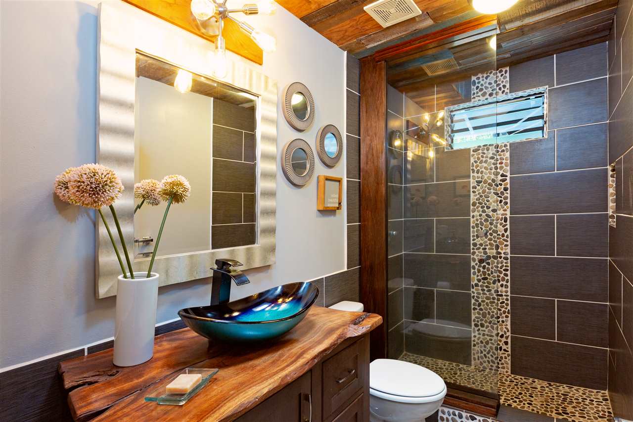 805 Kuulei Street Haiku, HI 96708 - Photo 10 of 28 a bathroom with a toilet sink and shower