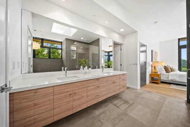 a view of a room with wooden floor and windows