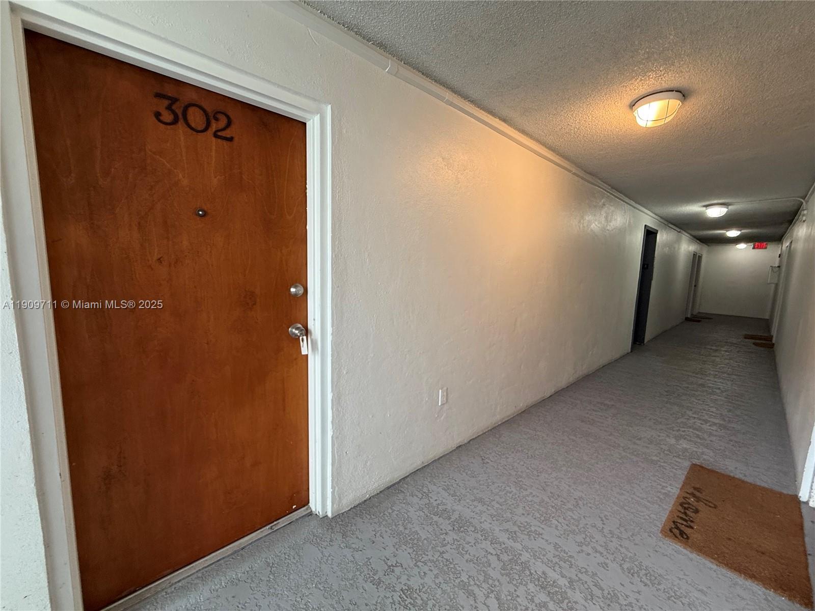 2920 Southwest 28th Terrace, Unit 302 Miami, FL 33133 - Photo 11 of 14 a view of a hallway